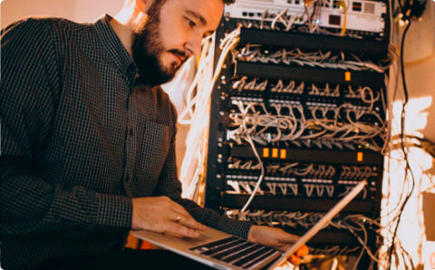 network engineer on laptop