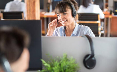 woman answering phone in a call center
